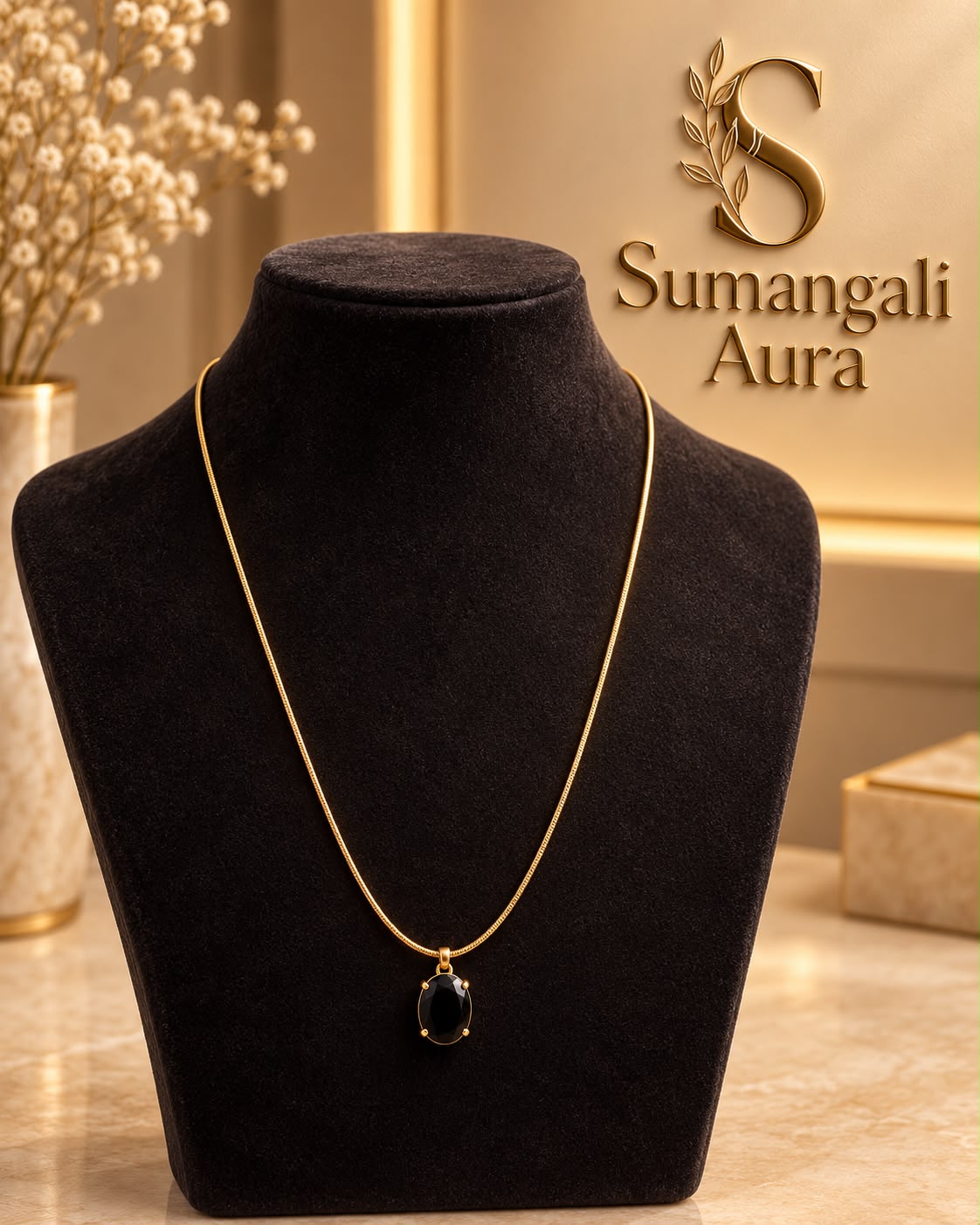 Gold-Tone Chain with Black Oval Pendant